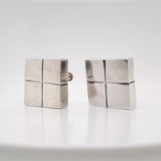 A very fine, three-piece Mexican silver modernist square cube clip-on earrings  and brooch.  By William Spratling.   With cube-shaped screw back earrings with screwbacks and a conformning cube-shaped brooch.     Simply a terrific parure from on of Mexico's jewerly masters!  Date: 20th Century  Overall Condition: It is in overall good, as-pictured, used estate condition. The three pieces have a wonderful, lived surface with some very fine & light surface scratches and other signs of expected ligh Cube Earrings, Vintage Mexican, Screw Back Earrings, Three Piece, Clip On Earrings, 3 Piece, 20th Century, Screw, Signs