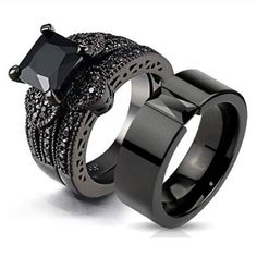 two rings with black diamonds on each side and one has a square cut diamond in the middle