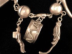 "Vintage Mexican sterling silver bracelet with Peruvian/South American style charms and silver balls, circa 1940s. Bracelet is 6 1/2\" long, with silver ball design and 9 charms ranging in size from 1/2\" to 1 1/2\" long. The charms include a drum, parrot, banana, person with basket, a coffee/cocoa bean, and other symbols. The bracelet has a box clasp with \"Hecho en Mexico\" stamped on the back. We ship with USPS, insured for the full value of the item." Vintage Silver Bracelet With Silver Beads, Silver Dangle Charm Bracelet, Unique Silver Dangle Charm Bracelet, Vintage Sterling Silver Bracelet With Charm, Sterling Silver Bracelet With Vintage Charm, Antique Sterling Silver Charm Bracelets, Antique Sterling Silver Bracelets With Charms, Heirloom Silver Bracelet With Vintage Charm, Vintage Sterling Silver Charm Bracelet With Dangling Charms