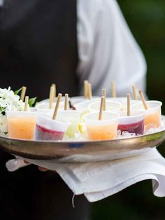 a plate with popsicle cocktails on it and the text, from a natural rustic wedding at ships of maine