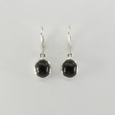 These is a beautiful pair of Black Onyx Earrings. The earrings are made out of solid 925 Silver and there is no nickel or other substances causing most allergies. This makes the earrings  hypo allergenic. Size of one earring in total: 3.1 x 1.0 cm or  1.22 x 0.39 inch The hooks are about 3/4 inch - or 1.8 cm -  in length. You will receive the item in a gift box - perfect to surprise someone or yourself. Usually we ship on the same day we receive the payment for the order. We want you to be happy Classic Oval Sterling Silver Earrings, Classic Black Oval Earrings, Black Onyx Oval Earrings, Black Oval Pierced Earrings, Oval Onyx Earrings For Gifting, Oval Sterling Silver Earrings With Polished Finish, Classic Nickel-free Oval Earrings, Black Sterling Silver Hoop Earrings For Everyday, Everyday Black Sterling Silver Hoop Earrings