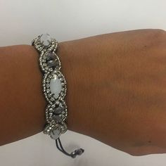 This Hand Stitched Beaded Bracelet Is Simply Stunning. It Features Silvery Hematite Beads, Opalescent Faceted Glass Beads, Silver Seed Beads And Tiny Austrian Crystals. This Artistic Bracelet Has A Macram Pull Cord Adjustable Closure And Is Suede Backed For Comfort. Wear Alone Or Stack Amongst Your Other Braceletsyou Are Bound To Get Compliments! Gift Boxed From Our Ny Boutique! One Size Fits Most Pull Cord Closure Macram Velvet Lined Hand Beaded Hand Stitched Natural Stones Silver Bohemian Beaded Bracelets With Macrame, Bohemian Silver Macrame Beaded Bracelets, Adjustable Silver Macrame Beaded Bracelets, Silver Beaded Braided Bracelets For The Beach, Handmade Adjustable White Crystal Bracelet, Handmade White Adjustable Crystal Bracelet, Bohemian Adjustable White Crystal Bracelet, Bohemian White Crystal Bracelet Adjustable, Bohemian White Adjustable Crystal Bracelet