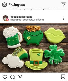 cookies decorated with shamrocks, hats and clovers are displayed on a wooden table