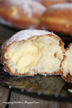 the doughnuts have been cut in half and are covered with powdered sugar