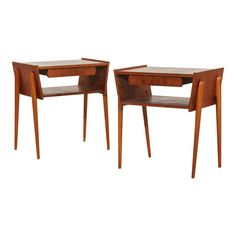 two wooden tables sitting next to each other