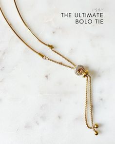 Embrace western fashion with a chic twist. Our new Sphere Bolo Tie style Necklace features a delicate Herringbone chain with two luxe rings - a luxury gold ring and our signature cubic zirconia ring. The perfect addition to any outfit, this bolo necklace is the ultimate modern western accessory. Cowgirl Bling Jewelry, Gold Sphere, Bolo Tie Necklace, Bolo Necklace, Western Accessories, Tie Necklace, Modern Western, Herringbone Chain, Bolo Tie