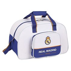 a white and blue duffel bag with the real madrid logo on it's side