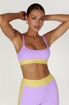 Race you to the top. Our BECCA Two Tone Cropped Sports Bra is designed with a cropped length, fully-lined, bodycon fit, wide straps and the option to remove the bust cups, making it a perfect choice for high impact sports or simply supportive for lounging. We’ve also incorporated our silicone MESHKI logo detailing throughout and our ultra soft FLEXI Butter fabrication for a supportive fit. Everyone at HQ is pairing this with our Alexandra Oversized Button Up Shirt and Taleah Two Tone Shorts to c Yellow Crop Top With Built-in Bra, Yellow Stretch Sports Bra, Yellow Stretch Sports Bra Athleisure, Yellow Stretch Sleeveless Sports Bra, Yellow Fitted Tank Top For Sports, Sporty Crop Top With Adjustable Straps And Medium Support, Yellow Sleeveless Stretch Sports Bra, Yellow Sports Tank Top, Yellow Stretch Seamless Sports Bra