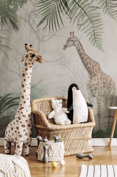 two giraffes and one penguin in a wicker basket on the floor