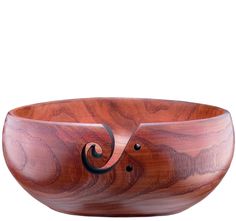 a wooden bowl with an intricate design on it