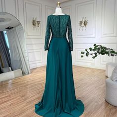 Exquisite mermaid gown in an elegant green hue, perfect for weddings, parties, and formal events. Crafted from luxurious satin, adorned with intricate lace and beaded embellishments for added glamour. Features a sophisticated mermaid silhouette that beautifully accentuates the feminine figure. Designed with high-quality materials for a comfortable and opulent feel. Ideal attire for women attending weddings, gala events, evening parties, and special occasions. Inspired by luxurious Dubai and Arab Green Mermaid Evening Dress With Sweep Train, Elegant Green Prom Gown, Green Floor-length Mermaid Dress With Sweep Train, Green Prom Season Gown With Sweep Train, Elegant Green Mermaid Dress For Evening, Elegant Green Mermaid Evening Dress, Green Mermaid Hem Gown For Prom Season, Green Floor-length Mermaid Dress For Formal Occasions, Green Long Sleeve Mermaid Dress For Wedding