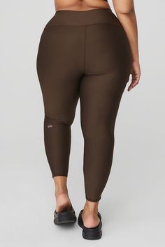 Wondering why these leggings are a fan favorite? Maybe it’s the sculpting, subtly sheeny, high-compression Airlift fabric. Or the fact that they fit like a glove, complete with a wide, double-layered waistband for a holds-you-in feel. Or the ⅞ length hems that are perfect for petites or an above-the-ankle fit. Pick your color and get ready to wear yours on repeat. Sleek Fitted Alo Yoga Activewear, Alo Yoga Tight Sporty Leggings, Alo Yoga Sporty Tight Leggings, Alo Yoga Compressive Sporty Leggings, Sporty Fitted Alo Yoga Leggings, Tight Sporty Alo Yoga Leggings, Alo Yoga Compression Athleisure Leggings, Functional Compression Nylon Leggings, Compressive Alo Yoga Activewear