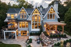 an aerial view of a large house at dusk