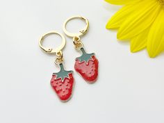 Gold Strawberry Earrings, Red Strawberry Foodie Dangle or Buggies Hoop Earrings, HOW TO ORDER 1) Select the quantity 2) Select style 3) Add to cart DESCRIPTION ♥ 18K Real gold plated stainless steel/brass ear hook 19-22mm. or 14.5x12mm hoop ♥ Zinc Base Alloy Enamel Pendants, Lead & Nickel Safe, approx. 10mm wide, 20mm long. ** Conversion: 1 inch = 25.4mm or 1mm = 0.0393 inches** ♥ All personalized is done by HAND. ♥ Raw materials the USA and international sourcing. ♥ I do not include invoice Red Dangle Clip-on Earring, Red Drop Clip-on Earrings As Gift, Red Dangle Single Clip-on Earring, Red Drop Clip-on Earrings For Gift, Red Small Hoop Metal Jewelry, Small Red Hypoallergenic Hoop Earrings, Small Hoop Red Metal Jewelry, Red Metal Small Hoop Jewelry, Red Clip-on Earrings As Gift