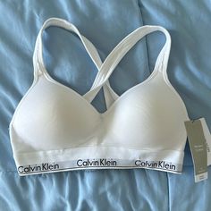 Brand New, Never Worn, Calvin Klein Modern Cotton Bra Calvin Klein Bra White, Calvin Klein Bra Outfits Fashion, Spring White Loungewear Bra, White Spring Loungewear Bra, White Bra For Spring Loungewear, White Seamless Casual Bra, Spring Stretch Calvin Klein Bra, Fitted Casual White Bra, Casual Fitted White Bra