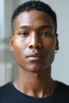 a close up of a person wearing a black shirt