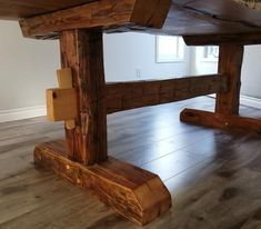 a wooden table sitting on top of a hard wood floor