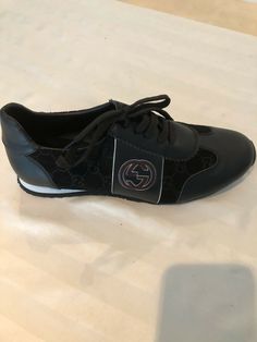 Gucci Sneakers. Never Worn Gucci Black leather and suede runners with Gucci logo on the suede parts and burgundy GG logo on both sides. Shoes are light weight. Made in Italy Size 43 Gucci Mens Sneakers, Gucci Mens, Gucci Sneakers, Gucci Logo, Gg Logo, Sneaker Shoes, Gucci Black, Gucci Men, Shoes Sneakers