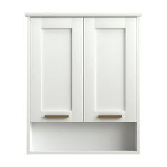 a white cabinet with two doors and gold handles