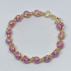 Beautiful Pink And Gold Bracelet 6 1/2in - 18k Gold Clasps - High Grade Tarnish Resistant Wire - Handcrafted Send Your Best Offer! Elegant Pink Jewelry Hand Wrapped, Elegant Pink Hand Wrapped Jewelry, Elegant Hand Wrapped Pink Jewelry, Pink Hand Wrapped Round Beads Jewelry, Pink Hand Wrapped Round Bead Jewelry, Hand Wrapped Pink Round Beads Jewelry, Hand Wrapped Pink Round Bead Jewelry, Pink Hand Wrapped Bangle Jewelry, Pink Gold Bracelet Gift