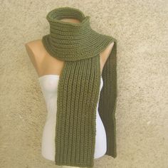 Chunky knit mens / womens scarf, army green, long, thick, double face, rib pattern. This unisex scarf is made from soft organic woolen yarn mixed with acrylic.  This warm scarf is knitted with thick double stitches, so it's soft, fluffy and elastic. This is a universal fashion accessory! Size: 19 cm (8 inches) wide Length: 200 cm (78 inches)  Color: army green Material: wool 50 %,  acrylic 50 % Production method: hand made, knitting I recommend hand wash in cool water max 30oС. Colors are stable Green Cozy Winter Scarves, Cozy Green Winter Scarves, Green Knitted Scarf For Winter, Green Winter Scarves One Size, Green Scarves For Winter, Thick Scarf, Womens Scarf, Women Scarf, Knit Men