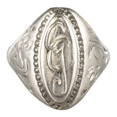 Ring in silver. The top of this signet ring is shuttle-shaped, the center is decorated with the initials GC surrounded by a beaded. On both sides, the start of the ring is chiseled with a plant motif. The carving is slightly weathered. Height: 21 mm, width: 11.7 mm, thickness: 2.1 mm, width of the ring at the base: 3.2 mm. Total weight of the jewel: 4.9 g approximately. US Size : 9,75 ; Free resize, please contact us. Authentic antique jewel - French work of the 19th century. Our opinion: A silv Silver Signet Ring, Dior Ring, Antique Rings, Black Enamel, Signet Ring, Vintage Rings, Antique Jewelry, Beautiful Rings, Statement Earrings