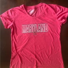 Maryland Tee Shirt. Size Xl Never Worn. Spring Fan Apparel Tops, Red Graphic Tee For Fans, Red Screen Print Shirt For Spring, Pink Cotton Fan Apparel Tops, Casual Pink Tops For Fan Merchandise, Red Relaxed Fit Fan Apparel T-shirt, Casual Red Shirt With Screen Print, Red Relaxed Fit T-shirt Fan Apparel, Red Relaxed Fit T-shirt For Fans