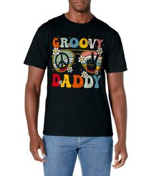 PRICES MAY VARY. Step back in time with our retro-inspired "Groovy Daddy" T-Shirt! This cool and nostalgic design features vintage text that exclaims "Groovy Daddy," surrounded by a burst of vibrant retro flowers, taking you straight to the psychedelic era of 60s and 70s! Perfect Gift Idea: Surprise your dad, partner, or any retro enthusiast with this unique & thoughtful gift. It's ideal for birthdays, Father's Day, Christmas, or any vintage occasion. Perfect gift for a first time dad, Pregnancy Retro Letter Print T-shirt For Spring, Black T-shirt With Retro Print Crew Neck, Retro Cotton T-shirt With Retro Print, Retro Graphic Design T-shirt For Spring, Black Retro Print Crew Neck T-shirt, Groovy Graphic Print Short Sleeve T-shirt, Black Retro T-shirt With Retro Print, Black Retro T-shirt With Vintage Print, Vintage Multicolor T-shirt With Letter Print