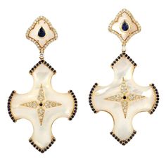 Hand cast from 18-karat gold, these stunning earrings are set with 1.2 carats blue sapphire, 31.34 carats pearl and .66 carats of glimmering diamonds. FOLLOW MEGHNA JEWELS storefront to view the latest collection & exclusive pieces. Meghna Jewels is proudly rated as a Top Seller on 1stDibs with 5 star customer reviews. All items manufactured by us are handmade and can be customized or redesigned. Composition Size-53x27 MM Total Weight-18.33 Gold Weight(Gms)-11.731 Diamond Wt(Cts)-0.66 Pearl Wt(C Luxury Sapphire Diamond Earrings, Luxury White Diamond Pierced Earrings, Luxury Sapphire Earrings, Luxury Pearl Earrings With Diamond Accents, Luxury Blue Pearl Drop Earrings, Sapphire Diamond Earrings, Art Deco Drop Earrings, Sapphire And Diamond Earrings, Freshwater Pearl Jewelry