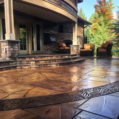 an outdoor patio with stone steps and chairs