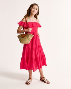 Flattering maxi dress in a soft cotton fabric, featuring off-the-shoulder detail, adjustable straps and a tiered skirt. Flattering Maxi Dress, Active Swimwear, Girls Maxi Dresses, Boys Romper, Girl Online, Abercrombie Kids, Boys Boots, Dress Girls, Tiered Skirt