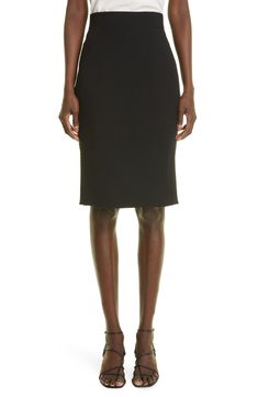 The brand's signature tailored style is evident in the stark silhouette and meticulous construction of this wool-blend pencil skirt. 24 1/2" length (size 8) Hidden side-zip closure 99% wool, 1% polyamide Dry clean Made in Romania Women's Designer Clothing Elegant Wool Skirt For Office, Elegant Black Business Skirt, Fitted Wool Pencil Skirt, Fitted Black Pencil Skirt For Business, Fitted Pencil Skirt For Business, Office Wool Skirt In Black, Elegant Wool Pencil Skirt, Formal Wool Pencil Skirt Knee-length, Formal Black Wool Skirt