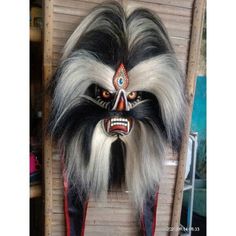 🌸FREE SHIPPING🌸 The Bujang Ganong mask is one of the complementary masks for the traditional art of Reog Ponorogo, Bujang Ganong is the Patih of Prabu Kelono Sewandono who created the Reog art. material: - wooden mask - Sintetic hair - peacock feather decoration on the forehead mask this mask beautiful as wall decor in your house, office, hotel or cafe...also perfect to use at halloween party 😍 for souvenir, gifts, etc. 🌺 Thank You 🌺 Traditional Masks And Prosthetics For Festivals, Traditional Black Costume Masks And Prosthetics, Traditional Masks For Masquerade And Festivals, Black Costume Masks And Prosthetics For Festivals, Traditional Festival Masks And Prosthetics, Traditional Masks And Prosthetics For Masquerade Festivals, Traditional Black Masks And Prosthetics For Carnival, Traditional Masks And Prosthetics For Carnival, Traditional Full Face Carnival Masks