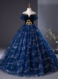 Every inch of this dress exudes elegance and fairy-tale allure! From the moment you slip into this stunning midnight blue gown, you'll feel like a princess stepping into a starry night. The golden embroidered detailing on the bodice creates a striking contrast against the deep, velvety fabric, making it both regal and radiant. The off-shoulder sleeves give a soft and ethereal feel, while the full tulle skirt, dotted with twinkling stars, ensures every movement is graceful and captivating. Perfect for a prom or any grand occasion, this dress brings a dreamy celestial charm to life, allowing you to shine under the spotlight with confidence and grace. Silver Homecoming Dresses, Vintage Simple Wedding Dress, Robes Quinceanera, Midnight Blue Gown, Champagne Homecoming Dresses, Celestial Dress, Haute Couture Wedding Dress, Full Tulle Skirt, Fuchsia Dress