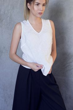 V-neck tank top made from pure, soft washed linen. «Must-have» basic linen shirt, that can be combined with any item from your closet. COMPOSITION - 100% linen, soft washed - Medium weight linen - Oeko-tex certified fabric, that does not contain any harmful substances and meets human-ecological requirements. SIZE - XS (US 2, UK 6, Europe 34, AU/NZ 6) Recommended size of BODY Bust: 31,5 in | 80 cm Waist: 24,4 in | 62 cm Hips: 33,8 in | 86 cm Size of GARMENT Bust: ± 33,8 in | 86 cm Length: ± 24,8 Relaxed Fit V-neck Tank Top For Spring, Solid Linen Summer Tank Top, Solid Linen Sleeveless Tank Top, Solid Color Linen Sleeveless Tank Top, Sleeveless Linen Tank Top, V-neck Linen Vest For Summer, Relaxed Fit Cotton V-neck Tank Top, V-neck Linen Summer Vest, Everyday Linen Tank Top