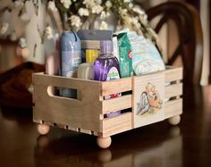 a wooden box filled with personal care items on top of a table next to a chair