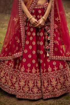 Deep red raw silk attached can-can lehenga intricately hand embroidered with silk threads, dabka, sequins and cutdana using traditional zardozi technique. Paired with embroidered padded blouse, sheer dupatta and bandhej dupatta.
Component: 4
Pattern: Embroidered
Type Of Work: Floral
Neckline: V neck
Sleeve Type: Elbow Sleeves
Fabric: Lehenga and Blouse- Raw Silk, Dupatta- Net, Dupatta-Bandhej
Color: Maroon
Other Details: 
Embroidered dupattas
Zardozi work
Floral motifs
Tassel detail
Occasion: Wedding,Bride - Aza Fashions Double Dupatta Bridal Lehenga, Double Dupatta Lehenga, Double Dupatta, Maroon Lehenga, Vacuum Storage, Red Lehenga, Half Sleeve Blouse, Sleeves Blouse, Silk Dupatta