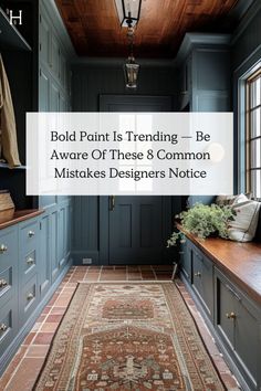 a hallway with blue cabinets and a rug on the floor that says bold paint is trending be aware of these 8 common mistakes