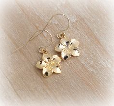 Gold Plumeria Earrings 18K Gold Vermeil Charm with 14K Gold filled French Earwire ♥ Charm measurement Plumeria flower ~ 1/2 inch x 1/2 inch *Check out my other charms! Comes boxed with a bow US shipping includes tracking Gem Passion Jewelry Tropical Earrings, Hawaii Jewelry, Jewelry Lookbook, Jewelry Inspo, Dream Jewelry, Pretty Jewellery, Ear Wire, Cute Jewelry, Handmade Earrings