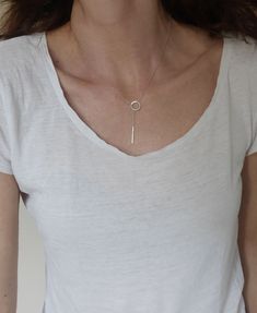 This Lariat necklace is totally handmade made from sterling silver. A dainty necklace that adjusts to any outfit. Great layering charm necklace, easy to wear on its own too. The diameter of the circle is 12 mm and the bar is 20 mm long. Length: 52 cm -----> 20 inches 62 cm -----> 24 inches 72 cm -----> 28 inches Feel free to ask for a different length. The necklace above is not the exact one you will receive. Each one is handmade to order and may slightly vary from the pictures. Please Minimalist White Gold Lariat Necklace With Delicate Chain, Minimalist White Gold Lariat Necklace, Sterling Silver Clavicle Chain Lariat Necklace For Everyday, Sterling Silver Lariat Necklace For Everyday, Everyday Sterling Silver Lariat Necklace With Clavicle Chain, Silver Minimalist Lariat Necklace, Silver Minimalist Lariat Necklace With Delicate Chain, Everyday Minimalist Lariat Necklace With Simple Chain, Minimalist White Gold Sterling Silver Lariat Necklace