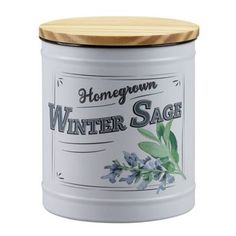 a white canister with a wooden lid that says winter sage on the front and side