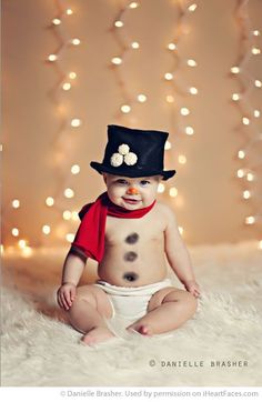 a baby wearing a top hat and diaper