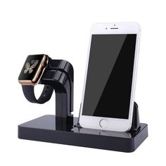 an apple watch and cell phone are sitting on a docking station with a charging dock