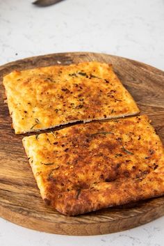 two slices of cheese pizza on a wooden plate