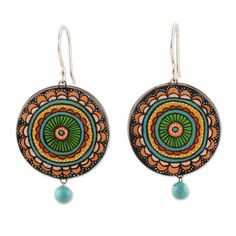 A captivating mandala pattern embellishes this adorable creation by Ritu Thapar. After finishing the design, Ritu collaborates with Indian artisans to craft these ceramic dangle earrings, both featuring hand-painted details and little beads joined to the accessory by copper wires. The final touch is in the comfortable sterling silver hooks that allow you to wear the earrings in all their glory. Bohemian Earrings With Artistic Design, Bohemian Artistic Earrings, Bohemian Round Earrings With Artistic Design, Hand Painted Turquoise Bohemian Earrings, Bohemian Hand Painted Round Jewelry, Sparrow Earrings, Mandala Jewelry, Mandala Designs, Terracotta Jewellery