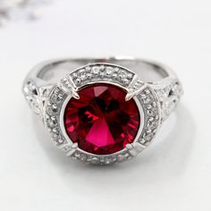 Women Sterling Silver Art Deco Design 2.5 carat Simulated Ruby Engagement Ring This beautiful Sterling Silver Art Deco Design 2.5ct Simulated Ruby Engagement Ring by DoubleAccent is meticulously crafted in gleaming and durable Sterling Silver. Our stones are the highest quality diamond simulants that are polished, finely cut, loupe clean, and have an exactly similar appearance and as beautiful as to naturally occurring diamonds. All cubic zirconia stone weights are approximate and listed as diam Elegant Red Crystal Round Ring, Elegant Red Round Crystal Ring, Classic Red Jewelry With Lab-created Ruby, Elegant Red Promise Ring, Formal Red Rings For Valentine's Day, Red Rings For Valentine's Day Formal Occasion, Classic Red Lab-created Ruby Jewelry, Red Valentine's Day Rings For Formal Occasions, Red Classic Birthstone Ring With Prong Setting