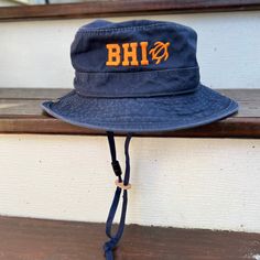 Sun protection meets fun and style with our BHI Embroidered Monogram UPF Boonie Youth Bucket Hat. This cool hat for kids features soft yet durable garment-washed-twill fabric for easy-wearing comfort and durability. A mesh lining promotes faster drying and cooling breathability. The boonie style gives all-around coverage with UPF 50 sun protection to shield against harsh rays. A breakaway chin cord feels comfy while keeping the hat in place. Cotton Durable & ideal for wear in the great outdoors Adjustable Fit Cotton Brimmed Bucket Hat, Adjustable Cotton Sun Hat, Adjustable Fit Cotton Bucket Hat With Wide Brim, Adjustable Cotton Bucket Hat With Wide Brim, Adjustable Cotton Wide Brim Bucket Hat, Adjustable Cotton Bucket Hat With Curved Brim, Adjustable Cotton Sun Cap, Casual Adjustable Fit Bucket Hat With Flat Brim, Casual Bucket Hat With Adjustable Fit And Flat Brim