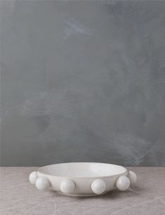 a white bowl sitting on top of a table