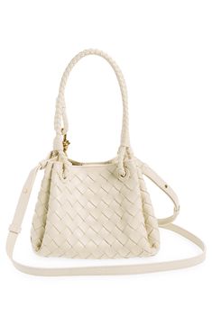 A single intricate knot—a key element of BV's DNA—adds a flash of gleam to this compact bag crafted using the label's signature handwoven intrecciato technique. Magnetic closure Top carry handles; removable, adjustable crossbody strap Leather Made in Italy Designer Handbags Elegant Formal Bucket Bag With Braided Handles, Elegant Satchel Bucket Bag With Intrecciato Weave, Elegant Bucket Bag With Intrecciato Weave Satchel, Elegant Woven Leather Crossbody Bucket Bag, Luxury Cream Shoulder Bag With Intrecciato Weave, Elegant Intrecciato Crossbody Shoulder Bag, Versatile Intrecciato Weave Crossbody Bag, Luxury Cream Intrecciato Shoulder Bag, White Intrecciato Weave Crossbody Bag