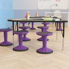 purple stools and tables in an office setting